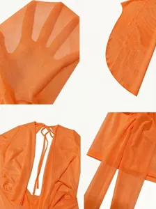 Dettaglio del tessuto dell'abito in rete trasparente arancione, scollo a V e maniche.