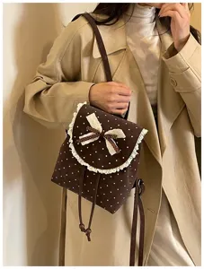 Korean style brown polka dot backpack with lace trim and bow for women autumn chic mini bag.