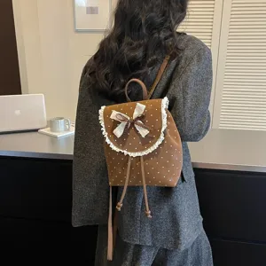 Stylish brown polka dot women backpack with cute white lace trim and sweet bow for daily use.