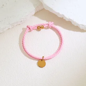 Pink braided leather cord bracelet with gold round tag pendant minimalist jewelry accessory