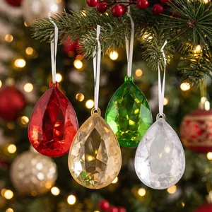 Detailed close-up shot of colorful teardrop acrylic ornaments hanging on Christmas tree branches.