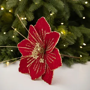 Red glitter artificial Christmas flower branch detail, velvet floral pick for holiday decor.