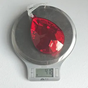 Detailed close-up shot showing the red teardrop acrylic Christmas tree ornament weighing 41.6g.