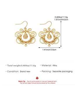 Vintage gold-plated filigree hollow drop earrings with crystal, elegant alloy jewelry.