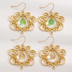 Bohemian vintage hollow gold-tone drop earrings with faceted teardrop crystals for women.