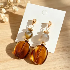Vintage acrylic long drop earrings with amber beads, elegant chic gold plated jewelry for women.
