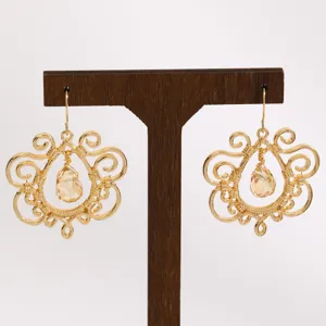Bohemian vintage gold-tone filigree teardrop crystal dangle earrings for women detail view.