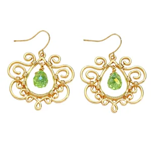 Detail shot of golden vintage wire wrapped drop green crystal earrings elegant design