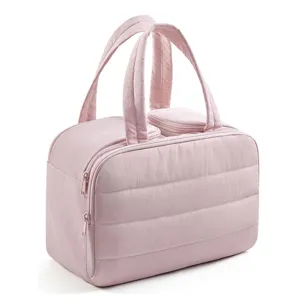 Quilted travel cosmetic bag with dual handles and zipper, pink makeup wash organizer.