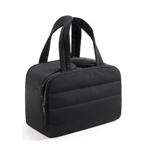 Black quilted travel makeup bag with handles and smooth dual zippers for cosmetic storage.