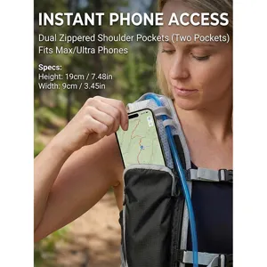 Detail view showing dual zippered shoulder pockets for instant phone access on hiking backpack.