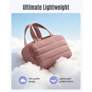 Quilted travel cosmetic bag detail showing lightweight puffer design and soft padded fabric.