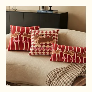 Close-up detail of cute cartoon dachshund decorative throw pillows arranged nicely on a cozy sofa.