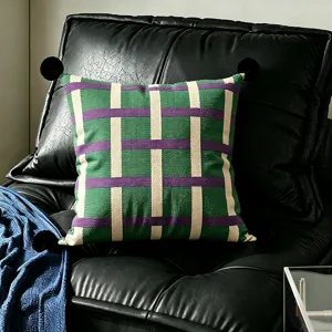 Bauhaus throw pillow cover with green plaid and black pom poms decorative cushion for sofa bed.