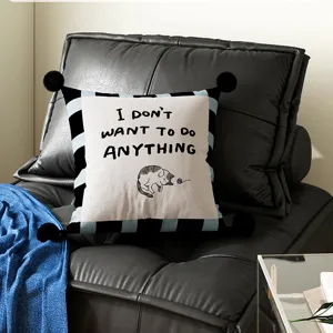 Close up detail view of decorative throw pillow featuring cute cat print and funny text.