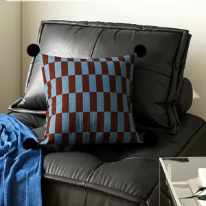 Blue brown checkered throw pillow with black pom poms for living room sofa couch decor