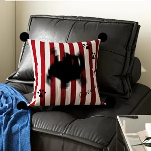 Red and white striped decorative throw pillow cover with black pom pom and cute paw prints.