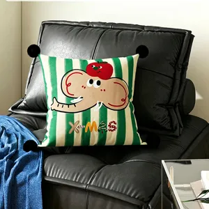 Green striped decorative cushion with cute elephant cartoon and black pom-poms detail.