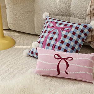 Cozy decorative throw pillows with cute bow patterns and soft pom-pom trim for living room.