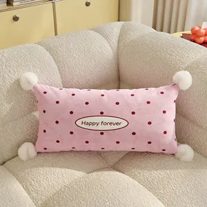 Pink polka dot rectangular throw pillow with fluffy pom pom and cute text design for sofa bed
