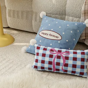 Decorative throw pillow set with cute polka dots, plaid pattern, pink bow, and fuzzy pom-poms.
