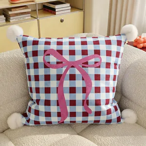 Cute blue red plaid throw pillow with pink bow and pom poms for living room sofa decor