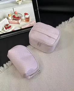 Pink polka dot cosmetic bag set, large capacity travel makeup organizer and portable toiletry pouch.