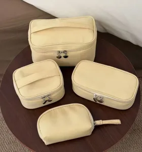 Yellow cosmetic bag set large capacity portable travel makeup storage organizer.