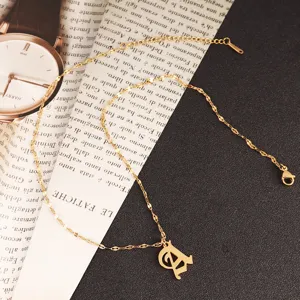 Detail shot of gothic letter A pendant necklace, stainless steel 18k gold plated.