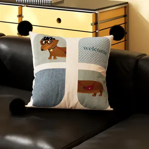 Close-up detail of cute dachshund throw pillow with pom-poms in cozy living room setting.