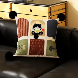 Closeup detail view of the cute black cat printed decorative cushion on dark leather sofa.