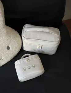 White velvet cosmetic bag set with floral embroidery, portable travel makeup organizer.