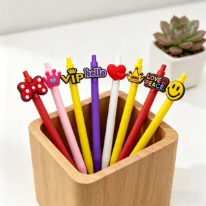 Cute retractable ballpoint pens with colorful silicone toppers, creative student stationery set.