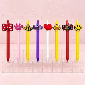 Colorful press gel pens set with cute silicone cartoon toppers and English word designs.