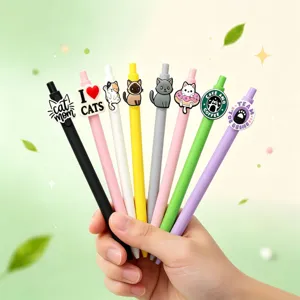 Leuke katten gelpen set met kleurrijke behuizing en schattige 3D siliconen toppers op kantoor.