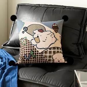 Detail shot of a cute cartoon Bauhaus style throw pillow with dog pattern and pom poms.
