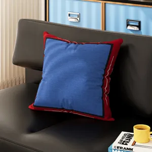 Bauhaus style decorative throw pillow, square red and blue design for modern living room sofa.