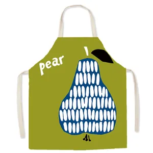 Detail shot of a green kitchen apron featuring a creative blue pear pattern and letter print.