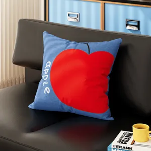 Bauhaus style blue throw pillow featuring a minimalist red apple design for home decor.