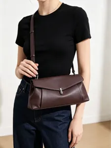 Bolso de hombro de cuero genuino para mujer, elegante bolso bandolera con cierre metálico.