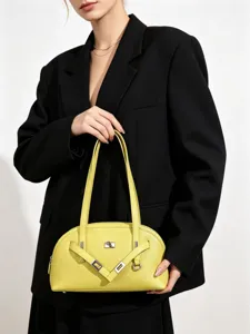 Stylish yellow leather shoulder bag for women, trendy commuter underarm handbag with metal lock.