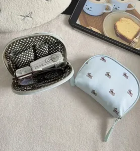Cute travel storage bag detail view, light blue cosmetic organizer with adorable puppy print.