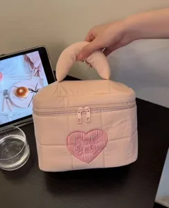 Pink quilted makeup bag with heart embroidery, large capacity travel cosmetic and toiletries pouch.