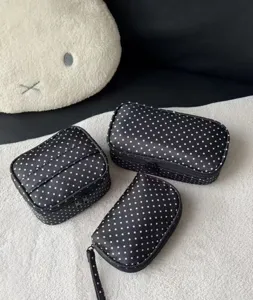 Black polka dot cosmetic bag set, large capacity portable travel toiletry storage case.