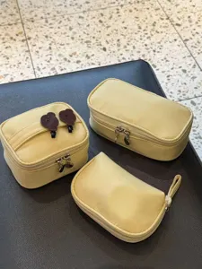 Yellow cosmetic bag set, portable makeup storage bags with cute bear clips and durable zippers.