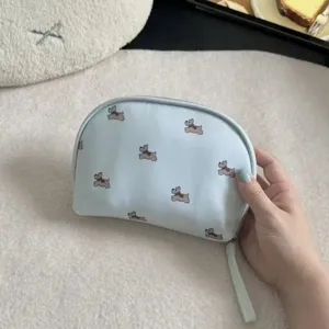 Portable cosmetic bag with cute dog pattern, multi-functional travel storage pouch for daily use.