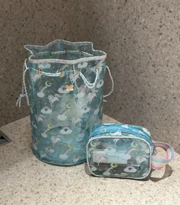 Transparent PVC cosmetic bag set with cute unicorn rainbow pattern, portable travel storage pouch.
