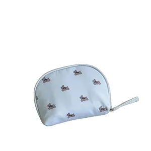 Cute light blue cosmetic bag with adorable Scottie dog pattern, portable travel organizer pouch.
