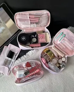 Detailed view of large capacity pink cosmetic bag, perfect travel makeup organizer pouch.