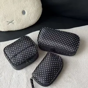 Classic black polka dot cosmetic bag set, large capacity portable travel toiletry storage pouch.